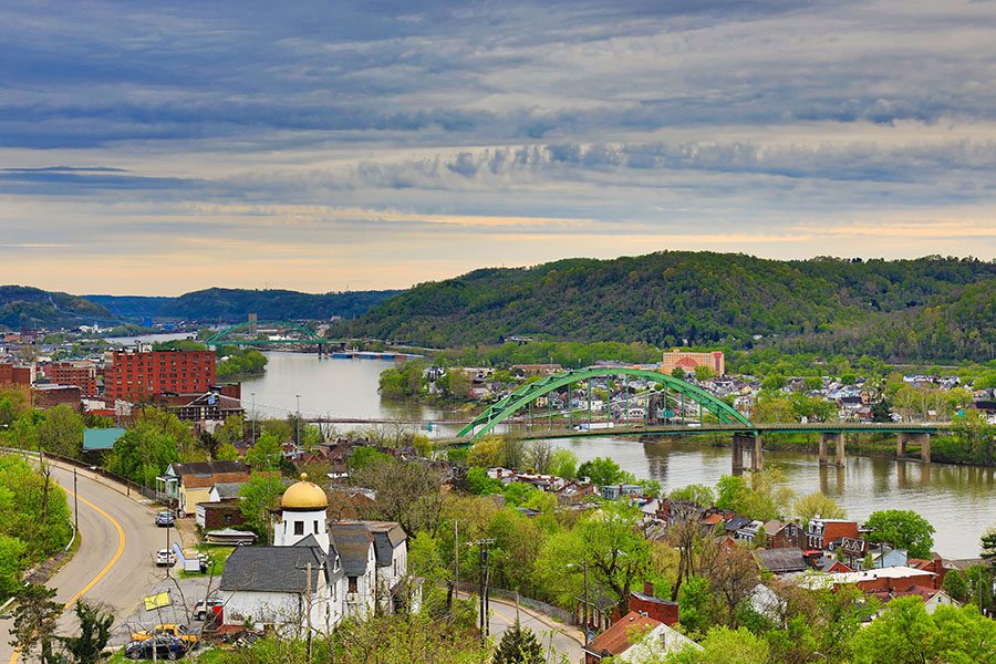 Contact - Aerial View of Wheeling, West Virginia Along the Ohio River With Skyline Cityscape Showing Wheeling Island in the Distance